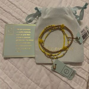 Enewton signature yellow 3mm bracelet along with 2 hope unwritten bracelets.